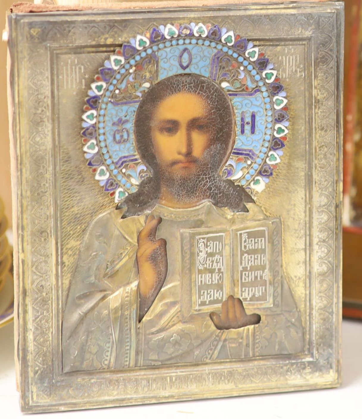 Late 19th century Russian School, tempera on panel, Icon of Christ Pantocrator, enamelled silver oklad, 18 x 14.5cm.